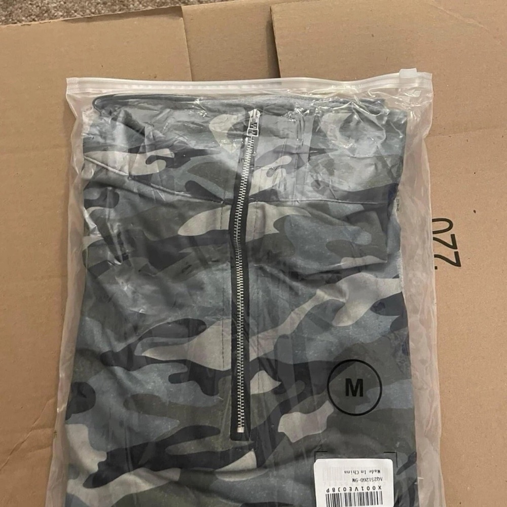 Women’s camouflage and grey partial zip up sweater